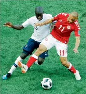  ?? — AP ?? Ngolo Kante (left) of France and Denmark’s Martin Braithwait­e vie for the ball during their group ‘C’ match at the Luzhniki Stadium in Moscow on Tuesday.