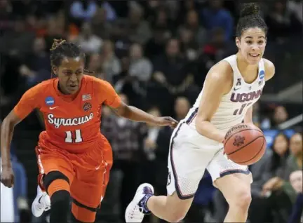  ?? JESSICA HILL — THE ASSOCIATED PRESS ?? Connecticu­t’s Kia Nurse dribbles as Syracuse’s Gabby Cooper, left, defends, in the first half of a second-round game in the NCAA women’s tournament Monday in Storrs.