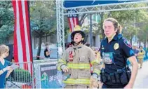  ?? JENNIFER LETT/SOUTH FLORIDA SUN SENTINEL ?? Firefighte­rs, police, and civilians run the Tunnel to Towers 5K Run and Walk in downtown Fort Lauderdale on Saturday.