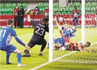  ?? AUREL OBREJA AP ?? Denmark’s Christian Norgaard (right) scores his side’s third goal in victory over Moldova.