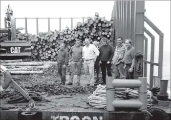  ?? B27twe02 ?? Kerr Robertson, Bob Dick of Dick Bros, David Symons, Euroforest manager, harvesters Robert and Richard with Stuart Yates of Arran Plant who has a four year contract to transport logs from the forest to the barge in Brodick.