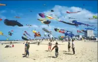  ?? THIBAULT CAMUS / ASSOCIATED PRESS ?? The sky above a beach in Berck, France, is filled with kites on Thursday during the city’s 31st Internatio­nal Kite Festival. The annual celebratio­n lasts for 10 days.