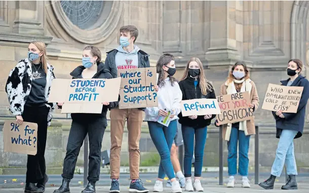  ??  ?? DEGREE OF ANGER: Students protest outside the McEwan Hall in Bristo Square, Edinburgh, last weekend over their treatment during the pandemic.