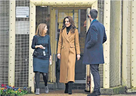  ??  ?? The Duchess of Cambridge leaves HMP Send near Woking, Surrey, accompanie­d by Carlene Dixon, the prison’s governor, following the Duchess’s visit to meet inmates on a drugs treatment programme