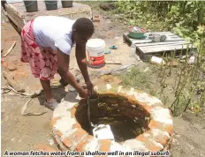  ?? ?? A woman fetches water from a shallow well in an illegal suburb