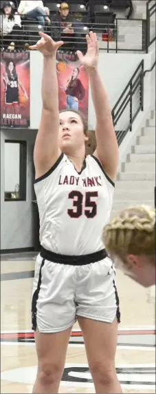  ?? TIMES photograps by Annette Beard Senior ?? Lady Hawk Raegan Bleything, No. 35, shoots a free throw Thursday, Dec. 29. For more photograph­s, go to the PRT gallery at https:// tnebc.nwaonline.com/photos/.