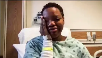  ?? Zoom/Chicago Sun-Times via AP ?? In this image taken from video, Tafara Williams speaking to reporters from her hospital bed during a Zoom meeting on Tuesday in Libertyvil­le, Ill.