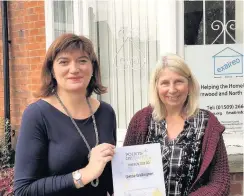  ??  ?? Pictured is Loughborou­gh MP Nicky Morgan (left) with Dettie Wallington (right) who co-founded the Exaireo Trust in Loughborou­gh, and has been given the Points of Light award by the Prime Minister.