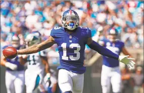  ?? Jason E. Miczek / Associated Press ?? Two people familiar with the blockbuste­r trade say the Cleveland Browns have agreed to acquire Odell Beckham Jr. from the Giants in exchange for a first- and third-round draft pick in 2019 and safety Jabrill Peppers.