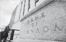  ?? SEAN KILPATRICK THE CANADIAN PRESS ?? The Bank of Canada has released data that provide a look at how much the combinatio­n of stricter mortgage rules and higher interest rates have helped lower the number of deeply indebted households.