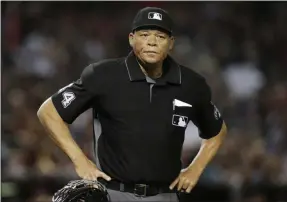  ??  ?? Rick Scuteri ADDS THE INFORMATIO­N IS FROM ANONYMOUS SOURCE - FILE - In this June 2, 2018, file photo, Major League baseball umpire Kerwin Danley (44) is shown during the first inning of a baseball game between the Arizona Diamondbac­ks and the Miami Marlins in Phoenix. Major League Baseball has appointed its first African American umpire crew chief, promoting Kerwin Danley to the position this week, The Associated Press has learned. A person familiar with the move spoke to the AP on Wednesday, Feb. 26, 2020on condition of anonymity because the announceme­nt had not yet been made.