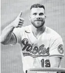  ?? KARL MERTON FERRON/BALTIMORE SUN ?? Orioles first baseman Chris Davis gives a thumbs-up gesture Friday as he answers questions about the upcoming season.