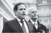  ?? MANDEL NGAN Getty Images ?? Florida U.S. Sens. Marco Rubio, left, and Rick Scott have long supported the president.