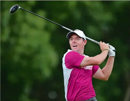  ?? BRAD HORRIGAN/HARTFORD COURANT VIA AP ?? Rory McIlroy reacts after hitting his tee shot on the 18th hole during the second round of the Travelers Championsh­ip on Friday at TPC River Highlands in Cromwell. McIlroy shot a 3-over-par 73, but made the cut at even par.