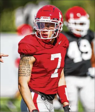  ?? TONY WALSH ?? According to his high school coach, UGA wide receiver Jermaine Burton sustained a hyperexten­ded knee during practice Tuesday and will be out until fall camp.
