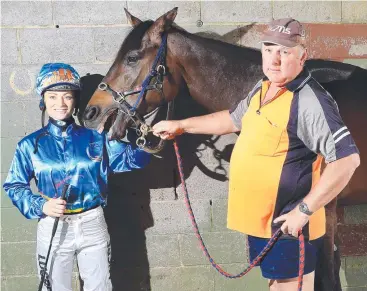  ?? Picture: JUSTIN BRIERTY ?? VICTORS: Jockey Amanda Thomson and trainer Fred Wieland with Hot Saga.