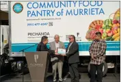  ?? COURTESY OF PECHANGA RESORT CASINO ?? Representa­tives of the Pechanga Band of Luiseño Indians donate a new refrigerat­ed truck to the Community Food Pantry of Murrieta on Monday. From left are Andrew Masiel Sr., a Pechanga board officer; the Rev. Carlos Martinez, executive director of the Community Food Pantry of Murrieta; Ken Perez, president of the Pechanga Developmen­t Corporatio­n; and Michael Murphy, a Pechanga board officer.