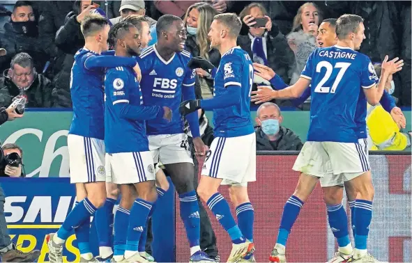  ?? ?? Leicester City’s Ademola Lookman, second left, celebrates with team-mates after scoring to inflict a rare defeat for Liverpool.