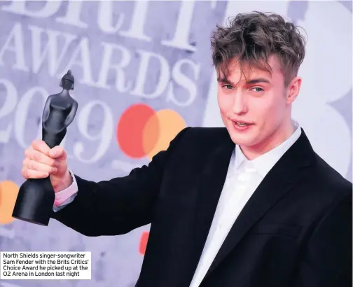  ??  ?? North Shields singer-songwriter Sam Fender with the Brits Critics’ Choice Award he picked up at the O2 Arena in London last night