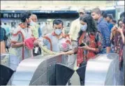  ?? RAJ K RAJ/HT PHOTO ?? ■
■ Delhi Metro Rail Corporatio­n staff disinfects an Automatic Fare Collection Gate at Rajiv Chowk on Thursday.