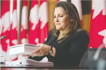  ?? ADRIAN WYLD/THE CANADIAN PRESS ?? Finance Minister Chrystia Freeland, seen at a news conference in April, is weighing pitches for Toronto or Montreal to host the Internatio­nal Sustainabi­lity Standards Board headquarte­rs.