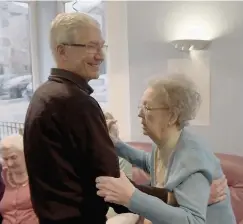  ??  ?? Lets dance Paul dances with service user Margaret McDougall