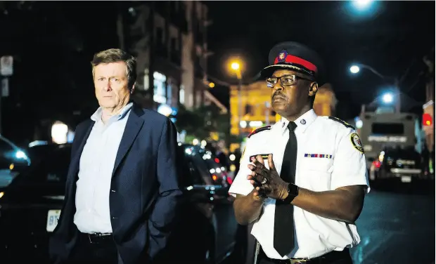  ?? CHRISTOPHE­R KATSAROV / THE CANADIAN PRESS ?? Toronto Mayor John Tory and Police Chief Mark Saunders speak to media following Sunday’s shooting.