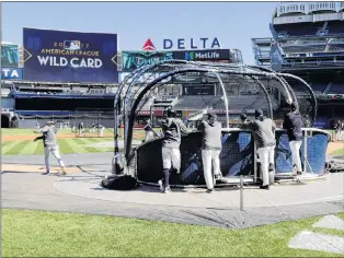  ?? AP PHOTO ?? The New York Yankees took batting practice Monday at Yankee Stadium in preparatio­n for tonight’s wild-card game..