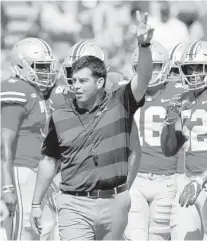  ?? JAY LAPRETE/AP ?? Ohio State’s Ryan Day is expected to make a smooth transition replacing retiring Urban Meyer after leading the program earlier this season