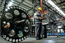  ?? GENG YUHE / FOR CHINA DAILY ?? An employee works at a textile machinery manufactur­ing plant in Lianyungan­g, Jiangsu province.