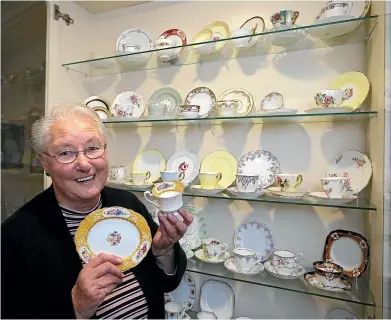  ?? JOHN BISSET/STUFF ?? Glass cabinets filled with cups and saucers adorn Bev Clayton’s hallway. She has collected 150 cups and saucers over the past 41 years.