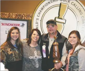  ?? SUBMITTED ?? David St. John of Conway poses with his family, from left, daughter Allie, wife Michele and daughter Kaylee, after he won the 2014 World’s Championsh­ip Duck Calling Contest on Nov. 22 in Stuttgart. St. John, a graduate of the University of Central...