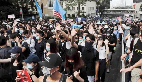  ?? AP ?? Demonstrat­ors in Hong Kong march to the US Consulate on Sunday to drum up internatio­nal support for their protest movement.