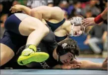  ?? NATE HECKENBERG­ER — FOR DIGITAL FIRST MEDIA ?? Malvern Prep’s Michael Beard works to turn Bethlehem Catholic’s Robert Sprezza during a 9-1 major decision in the 195-pound final.