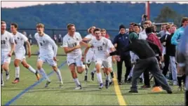  ?? AUSTIN HERTZOG — DIGITAL FIRST MEDIA ?? Spring-Ford’s Ronnie Minges (10) celebrates along the sideline after scoring the game-winning goal against Perkiomen Valley in the PAC semifinals.