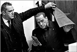  ?? MIGUEL MEDINA/GETTY-AFP ?? Former Prime Minister Silvio Berlusconi of Italy’s Forza Italia party gets ready to vote.