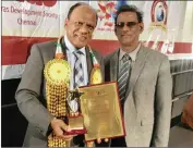  ??  ?? Businessma­n Vivian Reddy was presented with the World Tamil Economic Crown Jewel of the World award by the Mauritius’ Vice-President Paramasivu­m Pillay Vyapoory.