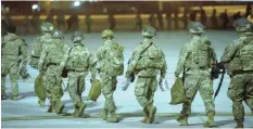  ?? | AP ?? US SOLDIERS board a C-17 aircraft yesterday at Fort Bragg, North Carolina, to be deployed in Iraq.