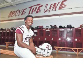  ?? SARAH WARNOCK, CLARION LEDGER ?? Nakobe Dean, one the highest rated players in Mississipp­i, sits in the locker room of Horn Lake High School.