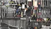  ?? YING FENG JOHANSSON Dreamstime via TNS ?? One possible garage remodeling option could be a dedicated organizati­on system for tools.