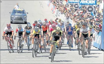  ?? VERN FISHER — STAFF PHOTOGRAPH­ER ?? Riders cross the finish line after Toms Skujins rode to victory on Tuesday during the Stage 3 of the Tour of California.