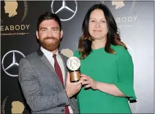  ?? PHOTO BY BRAD BARKET — INVISION — AP, FILE ?? Andy Mills, left, and Rukmini Callimachi hold the award for their 2018 podcast “Caliphate” at the 78th annual Peabody Awards in New York on May 18, 2019.