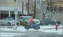  ?? SARA WAITE — JOURNAL-ADVOCATE ?? A four-wheel plow clears snow in downtown Sterling Tuesday, Nov. 29, 2022.