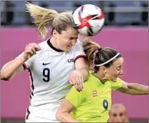  ??  ?? THE UNITED STATES’ Lindsey Horan, left, battles for the ball with Sweden’s Kosovare Asllani in the first half of their opener.