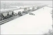  ?? TROY Fleece/leader-post ?? Weather conditions had traffic at a crawl heading northbound on the Trans-Canada Bypass at noon on Tuesday.