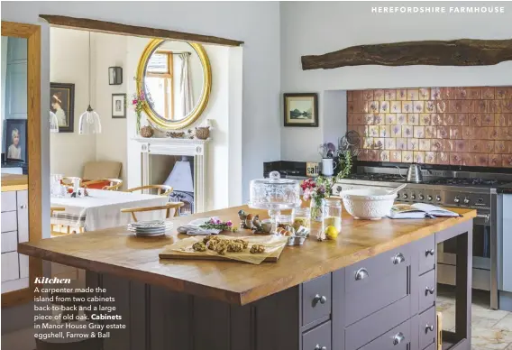  ??  ?? Kitchen
A carpenter made the island from two cabinets back-to-back and a large piece of old oak. Cabinets in Manor House Gray estate eggshell, Farrow & Ball