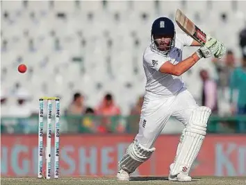  ?? AP ?? England’s Jonathan Bairstow drives a ball during his 89 on the first day of the third Test against India in Mohali yesterday.