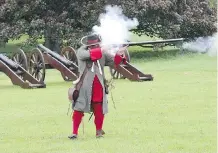  ??  ?? At the Battle of the Boyne site, visitors can see cavalry combat in full gallop ... and get a bang out of the musket demo.