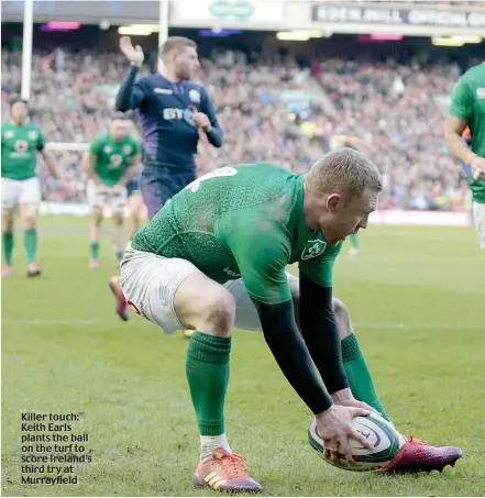  ??  ?? Killer touch: Keith Earls plants the ball on the turf to score Ireland’s third try at Murrayfiel­d