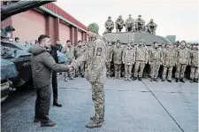  ?? GETTY IMAGES ?? British Prime Minister Rishi Sunak and Ukrainian President Volodymyr Zelenskyy visit a military facility to meet Ukrainian troops being trained on Challenger 2 tanks.